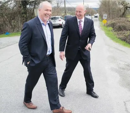  ?? DARRYL DYCK/THE CANADIAN PRESS/FILES ?? NDP Leader John Horgan, left, and house leader Mike Farnworth have their work cut out for them dealing with managing the day-to-day business of running the legislatur­e in a minority situation with the Greens.