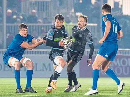  ?? Pictures: SNS. ?? Warriors’ Peter Horne tries to break away against Leinster at Scotstoun.