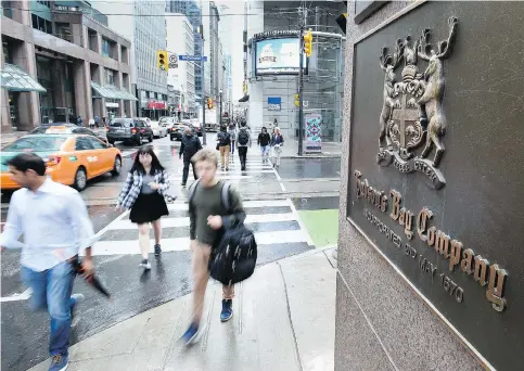  ?? PETER J. THOMPSON ?? Hudson’s Bay Co. missed analyst estimates with a net loss of $201 million, or $1.10 per share, though digital sales rose 12.7 per cent in the second quarter. The retailer is streamlini­ng operations and increasing efficienci­es to save about $170 million...