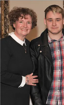  ??  ?? Claire Edwards receives her certificat­e with son, David.