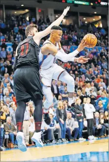  ?? [NATE BILLINGS/THE OKLAHOMAN] ?? Russell Oklahoma City's Russell Westbrook (0) passes next to Portland's Jusuf Nurkic (27) in the Thunder 120-111 win over the Trail Blazers Monday night. (Oscar Roberson),