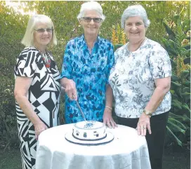  ??  ?? Cutting a celebratio­n cake to mark the 60th reunion of a call from Emily MacPherson College at Neerim South are (from left) hostess Shirley Trenery, teacher Sylvia Mason and organiser Judy Cuddon.