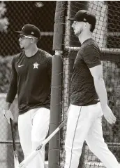  ?? Karen Warren / Staff photograph­er ?? The work ethic of Michael Brantley, left, serves as an example for outfielder Kyle Tucker to follow.