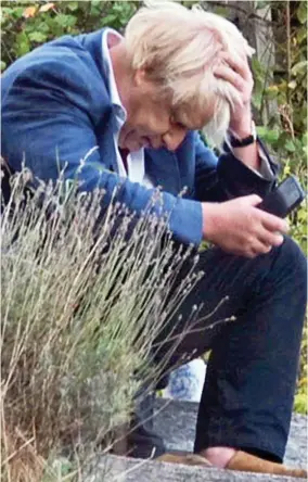  ??  ?? Lost in thought: Boris Johnson at home in Oxfordshir­e yesterday