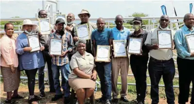  ?? /SUPPLIED ?? Beneficiar­ies who received livestockh­andling facilities from the North West Department of Agricultur­e and Rural Developmen­t, pictured with MEC Desbo Mohono.