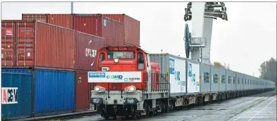  ?? PHOTOS BY CHEN YICHEN / XINHUA ?? A freight train chartered by Decathlon, a French sports goods retailer, arrives at Dourges, Pas-de-Calais in France from Wuhan, Hubei province, in November.