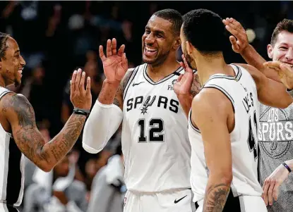  ?? Kin Man Hui / Staff photograph­er ?? One year ago, Lamarcus Aldridge (12) and the Spurs beat the Mavericks the day before COVID-19 shut down the NBA. Now the Spurs face the same opponent and have the same goal of making the playoffs in their first game of the second half of the season.