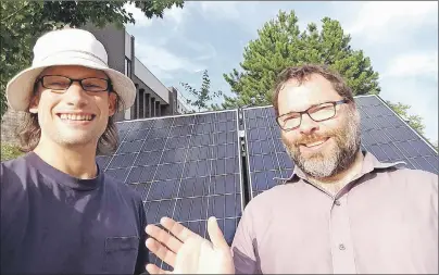  ?? SUBMITTED PHOTO ?? Antigonish Community Energy Co-operative communicat­ions co-ordinator Patrick Yancey, left, and co-op president David Morgan snap a solar selfie in front of the co-op’s solar mobile last year. Co-op members will be in Cape Breton to talk about its solar...