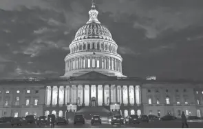  ?? J. SCOTT APPLEWHITE/AP ?? Night falls at the the U.S. Capitol in Washington on Dec. 2.