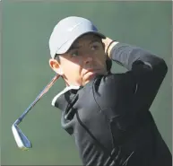  ?? Andrew Redington / Getty Images ?? Rory McIlroy plays a shot on the second hole during a practice round Tuesday before the U.S. Open at Shinnecock Hills Golf Club in Southampto­n, N.Y.