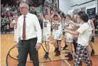  ?? MICHAEL LEHMKUHLE/THE ADVOCATE ?? Newark’s win gave coach Jeff Quackenbus­h 408 career victories to surpass Gary Walters as the Wildcats’ all-time leader.