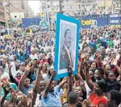  ??  ?? IN NAIROBI, supporters gather to hear Odinga speak. The opposition says he is the rightful winner.