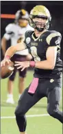  ?? Dave Phillips / For Hearst Connecticu­t Media ?? Hand QB Patch Flanagan looks for a receiver during a football game Friday night.