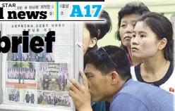  ?? AP ?? People look at the display of a local newspaper reporting the meeting between North Korean leader Kim Jong-un and US President Donald Trump, at a subway station in Pyongyang yesterday.