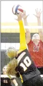  ?? PHOTO BY RICK PECK ?? McDonald County’s Bailey Rickett goes for a block on Diamond’s Grace Donnel (10) in a pre-season jamboree held Aug. 16 at Diamond High School.