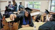  ?? SUBMITTED PHOTOS — MANOR COLLEGE ?? Members of Manor College’s Class of 2018 celebrate their commenceme­nt May 17.