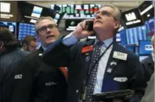  ?? RICHARD DREW — THE ASSOCIATED PRESS ?? Traders Eric Schumacher, left, and Richard Deviccaro work on the floor of the New York Stock Exchange, Thursday, Nov. 8.