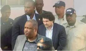  ?? Photograph: Kris Ingraham/AFP/Getty Images ?? FTX founder Sam Bankman-Fried is led away handcuffed by officers of the Royal Bahamas police at a Nassau courthouse.