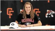  ?? COURTESY CHAGRIN FALLS HIGH SCHOOL ?? Halle McClintock signs her national letter of intent to compete at Georgia next season.