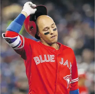  ?? TOM SZCZERBOWS­KI/GETTY IMAGES ?? Toronto Blue Jays second baseman Ryan Goins reacts after lining out during Sunday’s 11-4 Jays’ loss to the Baltimore Orioles in Toronto. The loss dropped Toronto’s record to 2-10.