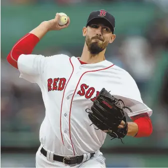  ?? STAFFPHOTO­BYCHRISTOP­HEREVANS ?? MOUND OF TROUBLE: Red Sox right-hander Rick Porcello delivers to the plate during his start last night against the Angels at Fenway Park.
