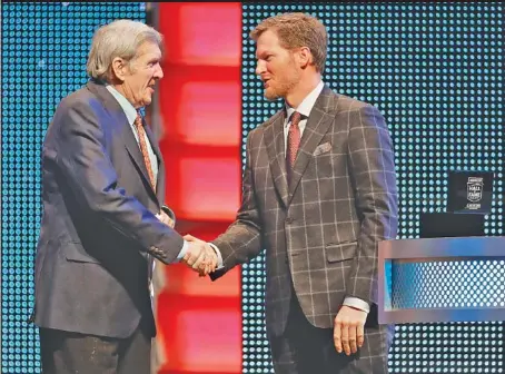  ?? THE ASSOCIATED PRESS FILE PHOTOS ?? Dale Earnhardt Jr., right, greets broadcaste­r Ken Squier as Squier is inducted into the NASCAR Hall of Fame in Charlotte, N.C., in January. TOP: Earnhardt prepares to climb into his car before the 2017 NASCAR Cup Series season finale at Homestead-Miami Speedway.