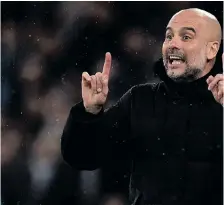  ?? OLI SCARFF AFP ?? PEP Guardiola’s Manchester City are still waiting to be crowned European champions despite the billions invested by the club’s Abu Dhabi-based owners over the past 14 years. |