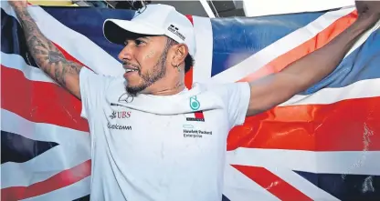  ?? Picture: Getty. ?? Lewis Hamilton celebrates in Mexico on Sunday after his fourth-placed finish was enough to secure his fifth world title – and his fourth in five years.