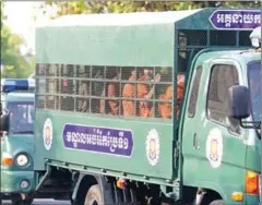  ?? PHA LINA ?? Seven CNRP activists are transporte­d to the Appeal Court in Phnom Penh.