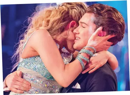  ??  ?? Show’s over: Mollie King and AJ Pritchard share an embrace last night