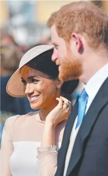  ?? Picture: GEORGES ROGERS/SIPA/MEGA ?? The Duke and Duchess of Sussex attend The Prince of Wales' 70th Birthday Patronage Celebratio­n in the Gardens of Buckingham Palace.