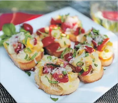  ?? THERESA FORTE SPECIAL TO THE ST. CATHARINES STANDARD ?? Niagara bruschetta with Sweet Gold, Sweet Million and Midnight Snack tomatoes, basil and Parmesan cheese, served alfresco with a chilled glass of Niagara Riesling. Setting up for a morning of taste-testing my homegrown tomatoes — this pleasant task makes all of the work worthwhile. Clockwise from the top:Ananas Noire, Rainbow, Midnight Snack, Sweet Gold, Ruby Indigo, Sugar Rush, Super Marzano.