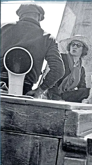  ??  ?? Margaret Fay Shaw, centre, with cairn terrier Mr Smith aboard the Gille Brighde off Barra in 1935