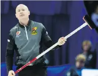  ?? ADRIAN WYLD / THE CANADIAN PRESS ?? Skip Kevin Koe from Calgary reacts to a shot entering the house during Olympic curling trials action against Team Morris on Thursday in Ottawa.