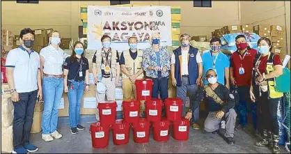  ??  ?? A delegation from the Philippine Disaster Resilience Foundation and its private sector partners turn over two tons of hygiene and dignity kits and food packs for families in Cagayan Valley affected by Typhoon Ulysses to the Office of Civil Defense Region 2.