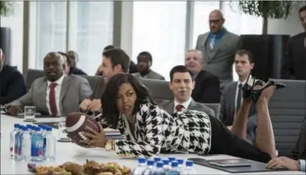  ??  ?? PARAMOUNT PICTURES Taraji P. Henson’s Ali thought she’d earned a promotion at work in an early scene in “What Men Want,” but the football representi­ng the partnershi­p position was meant for a male colleague sitting farther down the table.