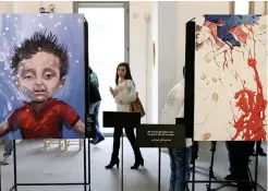  ??  ?? The exhibition Haneen, which means ‘nostalgia’ in Arabic, showcases paintings and drawings inspired by the poetry of children who make up some of the 1.1 million Syrian refugees living in Lebanon. (AFP)