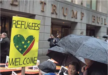  ?? DREW ANGERER, GETTY IMAGES ?? Protesters rally against the Trump administra­tion’s proposed travel ban March 28 in New York.