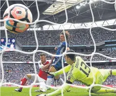  ?? Pictures: Getty. ?? Top: Arsenal captain Per Mertesacke­r with the FA Cup after their success over Chelsea, secured by Aaron Ramsey’s goal, above; Gunners boss Arsene Wenger, right, enjoys his seventh FA Cup success.