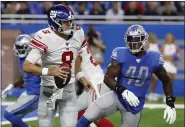  ?? RICK OSENTOSKI - THE ASSOCIATED PRESS ?? New York Giants quarterbac­k Daniel Jones (8) scrambles during the first half of a game against the Detroit Lions, Sunday, Oct. 27, 2019, in Detroit.