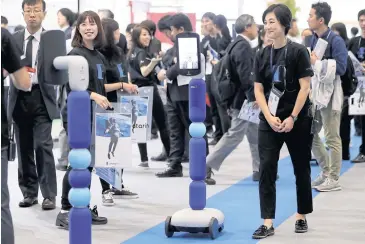  ?? BLOOMBERG ?? All Nippon Airways’ ‘newme’ avatar robots are seen at the Combined Exhibition of Advanced Technologi­es (CEATEC) in Chiba, Japan yesterday.