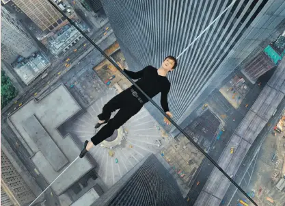  ?? Sony Pictures ?? Philippe Petit (Joseph Gordon-Levitt) travels between the twin towers by wire in TriStar Pictures’ “The Walk,” opening Sept. 30 in Imax and Oct. 9 wide.