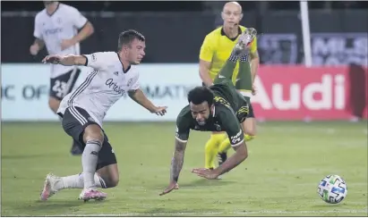  ?? JOHN RAOUX - THE ASSOCIATED PRESS ?? Union defender Kai Wagner, left, and Portland midfielder Eryk Williamson collide during the first half of an MLS Is Back semifinal in Kissimmee, Fla. The Timbers held on to eliminate the Union, 2-1.