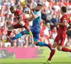  ??  ?? LIVERPOOL: Liverpool’s Spanish defender Alberto Moreno (L) vies with Arsenal’s French striker Olivier Giroud during the English Premier League football match between Liverpool and Arsenal at Anfield in Liverpool, north west England yesterday. — AFP