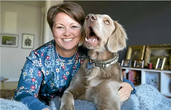  ?? KAVINDA HERATH/ STUFF ?? Tapanui woman Natasha Chadwick with her longhaired weimaraner puppy, Bodhi, who escaped from a friend’s house in Invercargi­ll last month.