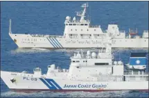  ?? Kyodo News/the Associated Press ?? Ships of China Marine Surveillan­ce and Japan Coast Guard steam side by side near disputed islands in the East China Sea.