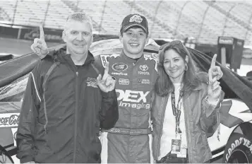  ?? JARED C. TILTON, GETTY IMAGES ?? Harrison Burton, center, has the support of parents Kim and Jeff, a former NASCAR driver.