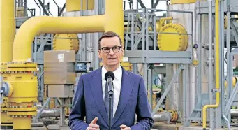  ?? | AFP ?? POLISH Prime Minister Mateusz Morawiecki speaks to the media on Russia halting the country’s gas supply at a gas transmissi­on point in Rembelszcz­yzna near Warsaw, yesterday.