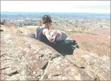  ?? STEVE FAGIN/SPECIAL TO THE DAY ?? Maria Shaw plays a hang drum on Mount Higby, near the Meriden/ Middlefiel­d border.