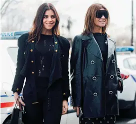  ??  ?? From top: Restoin Roitfeld in matching black looks with her mother, Carine Roitfeld. Restoin Roitfeld aceing masculine/feminine dressing with a tuxedo and exposed lingerie. OPPOSITE: (From top) Restoin Roitfeld elevates a classic coat with high-shine texture. A skirt-and-sweater combo is given a cool-girl spin with a high slit and lace-up boots